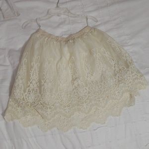 Cream skirt with intricate detailing